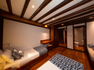 cabin with two seperate beds on our Coralia Liveaboard in Indonesia