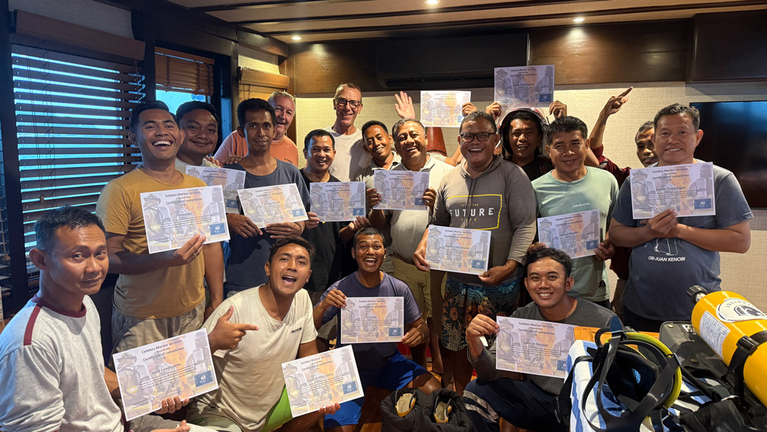 Coralia crew with fire safety training certificates