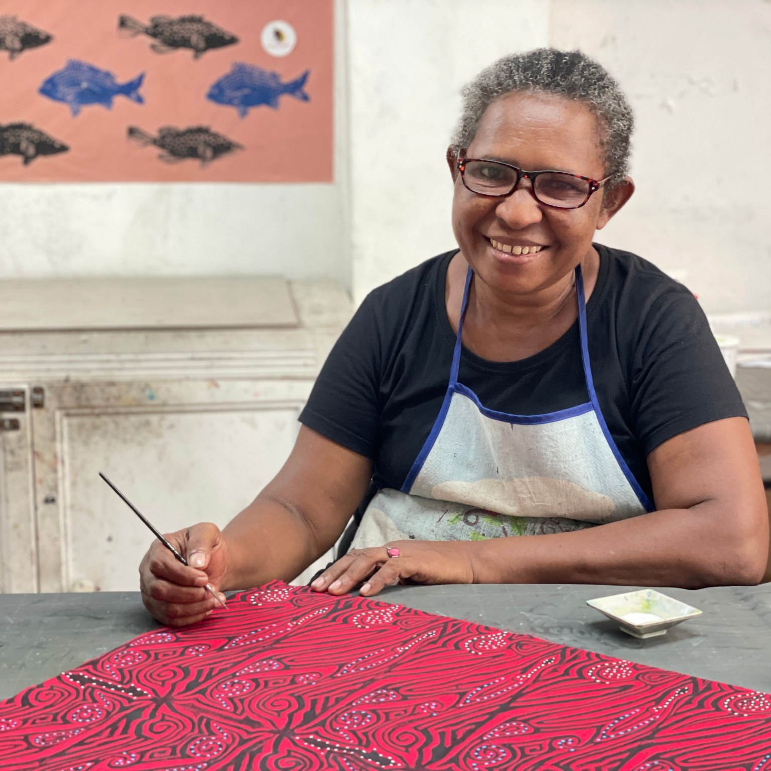 Papuan designs making custom batiks for Coralia Liveaboards.