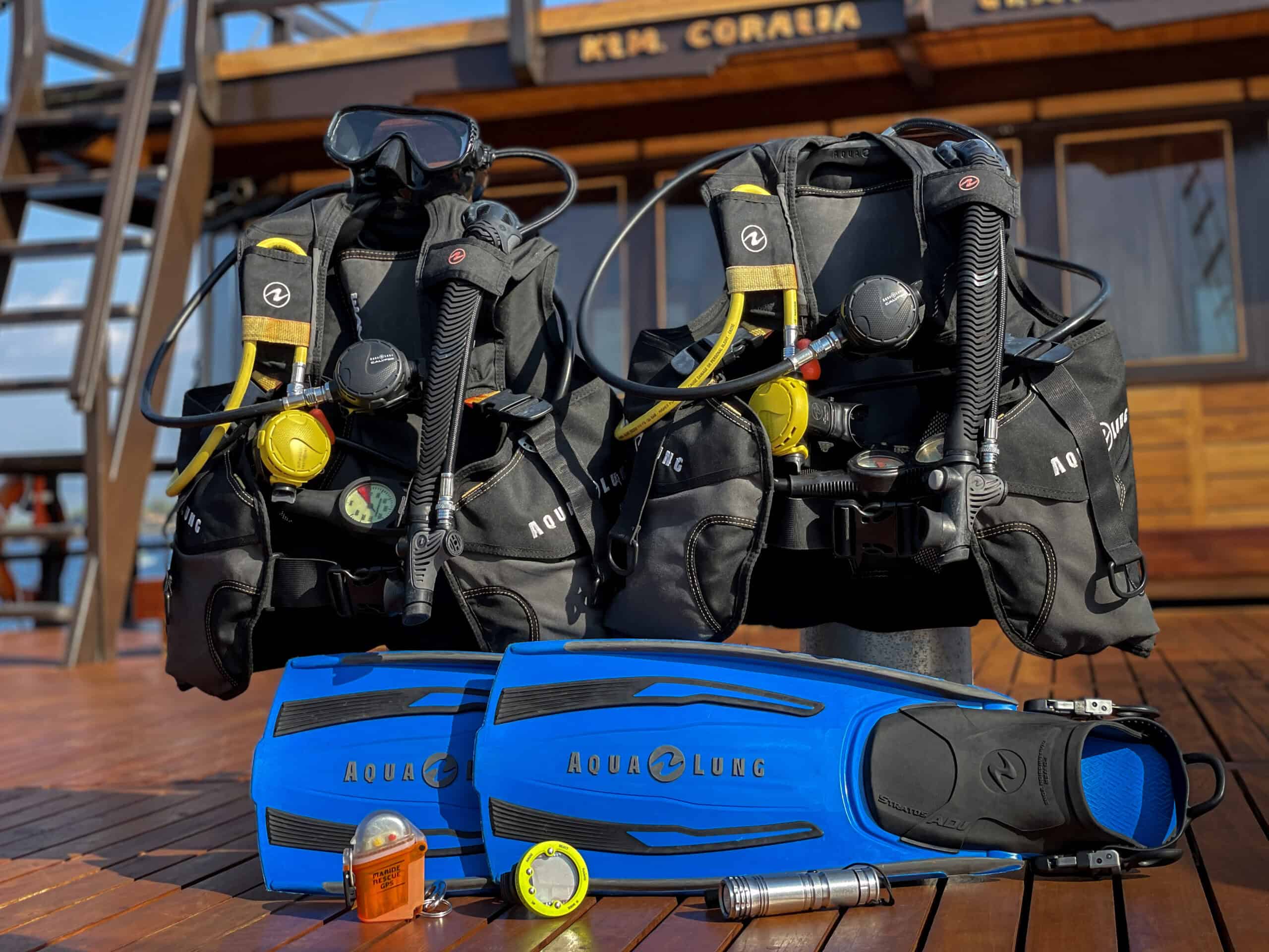 Two regulators, two BCDs, fins, nautilus lifeline. Coralia scuba diving rental gear.